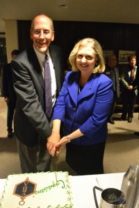 Ceremonial cutting of the cake with Rockford Chapter President Jeff Fahrenwald and Sigma Beta Delta President Dr. Sandra Hile Hart.